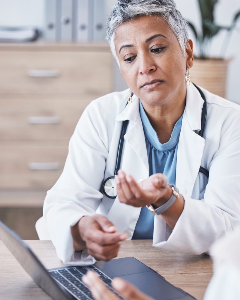 Doctor, laptop and woman consulting in Telehealth, healthcare prescription or medicare diagnosis at